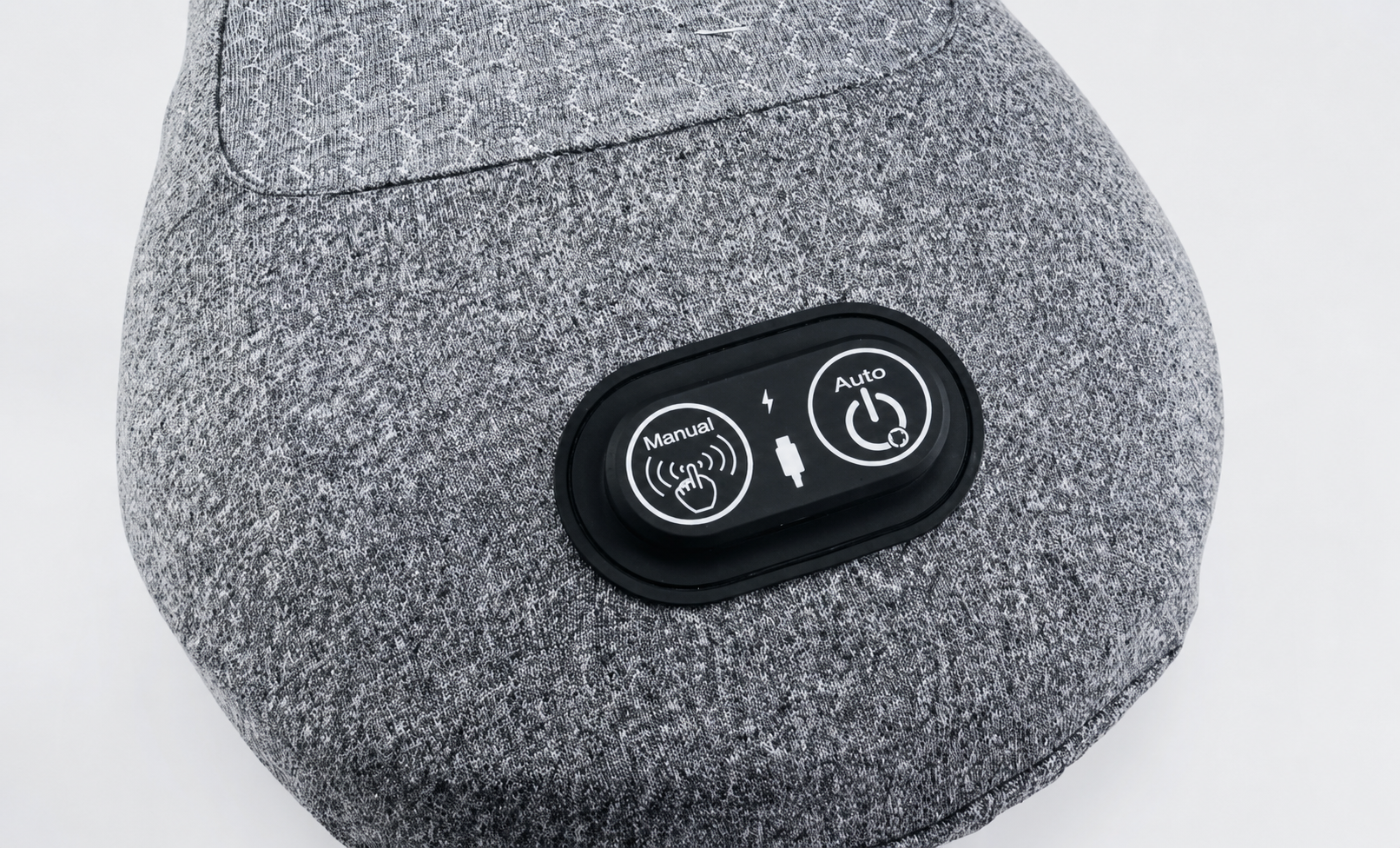 Close-up of the Orevive SpineEase control buttons and intensity settings